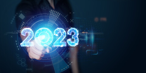 Happy new year, businessman points to the number 2023. Magazine style, banner, website header, web poster.