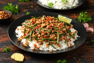 Pork Stir Fry with Green Beans, rice, garlic, chili and ginger. Asian food.