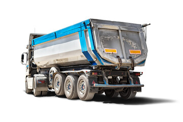A large dump truck unloads rubble or gravel at a construction site. Car tonar for transportation of...