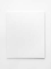 empty white canvas on a white table. space for text, template for design