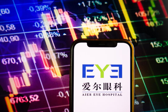 KONSKIE, POLAND - September 10, 2022: Smartphone displaying logo of AIER Eye Hospital company on stock exchange chart background