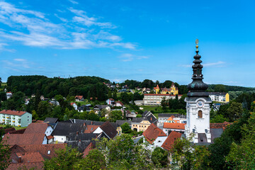 Beautiful aerial view of Ehrenhausen town with the clock tower of the Catholic pilgrimage church in foreground, Leibnitz, south Styria, Austria