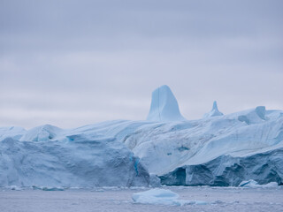 Awe-inspiring icy landscapes at the mouth of the Icefjord glacier (Sermeq Kujalleq), one of the fastest and most active glaciers in the world. Disko Bay, Ilulissat, Greenland