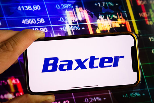 KONSKIE, POLAND - September 10, 2022: Smartphone displaying logo of Baxter company on stock exchange chart background
