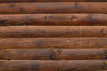 Fototapeta premium Wooden background. Wall made of wooden beams.