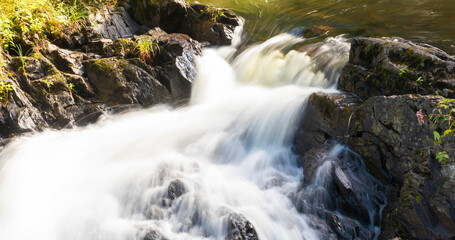 Fototapeta na wymiar Motion blur in a Maine cascade
