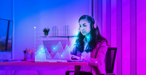 Futuristic telecommunication working concept, Female in headset working with computer laptop hologram graphic chart