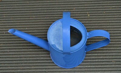 Metallic, blue watering can