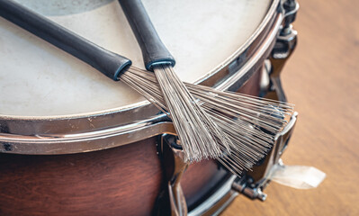 Close-up, drumsticks on a blurred background.