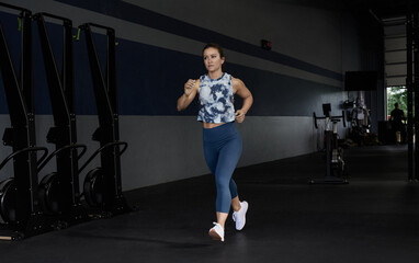Woman running out of gym
