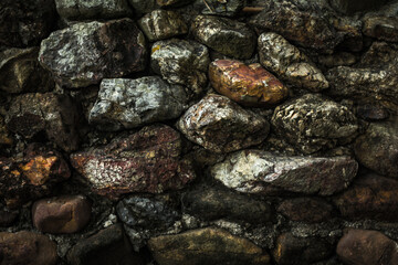 Texture wet rock wall wallpaper in dark