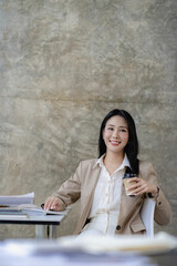 Smiling Asian businesswoman working on laptop in modern office, accountant, concept, analysis, business, report, graph, financial chart corporate economy, banking, market research