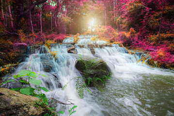 beautiful colorful waterfall in forest. amazing wonderful landscape paradise scenic background.