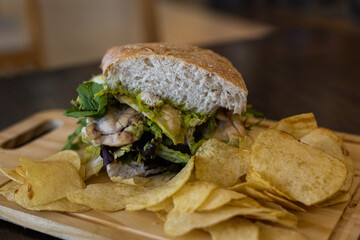 Chicken sandwich with salad and potatoes 