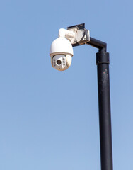 Surveillance camera against sky