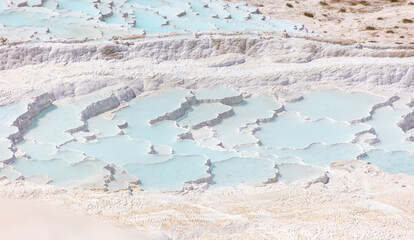 Emerald water in white limestone rock.