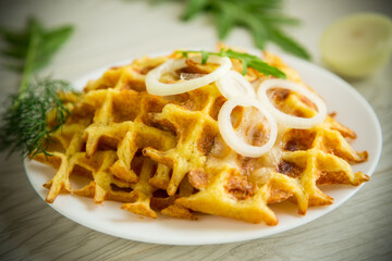 fried potato cheese vegetable waffles with bacon and onions