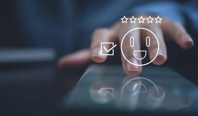 Customer experience, Client's satisfaction survey concept. Woman touching face emoticon on virtual touch screen on mobile phone. Customer service evaluation