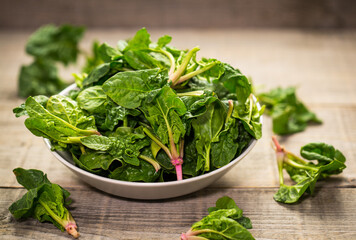 Fresh young spinach in the bowl