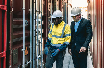 Container operator showing his boss the problem with the container while working in container yards.