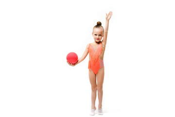 Small artistic gymnast girl with rubber ball