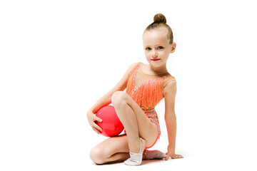 Graceful little gymnastic acrobat girl with ball