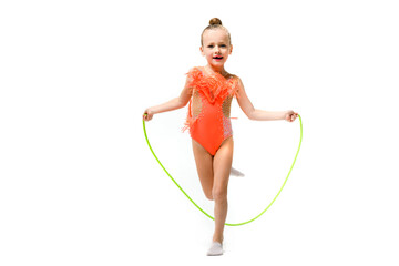 Sporty gymnast pretty child jump with rope