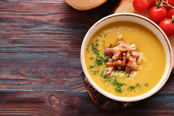 Pumpkin puree soup with bacon and onion. Autumn soup. Top view, copy space