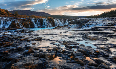 Scenic image of Iceland. Incredible nature landscape. Stunning view of Bruarfoss Waterfall. Azure...
