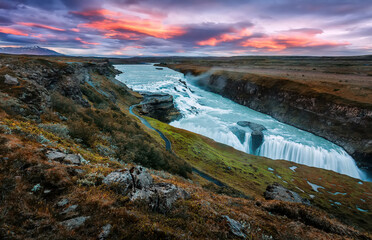 Amazing Nature landscape of Iceland. Impressively beautiful Gullfoss waterfall in canyon with colorful sky during sunset. Tipical Iceland scenery. Iconic location for photographers and bloggers