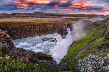 Amazing Nature landscape of Iceland. Impressively beautiful Gullfoss waterfall in canyon with colorful sky during sunset. Tipical Iceland scenery. Iconic location for photographers and bloggers
