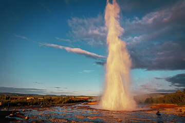 Stunning Eruption of Strokkur Geysir in Iceland during sunset. Strokkur Geyser Popular touristic location and travel destination of Iceland. Amazing nature landscape. Instagram filter.