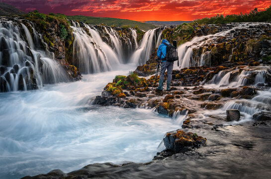 A beautiful river morning with waterfal and sun light. Scenic image of Iceland. Colorful sunset over the Bruarfoss Waterfall with  picturesque sky during sunset. Amazing nature of Iceland