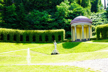 park landscaping with green tunnel and gazebo in park Kleve in Germany 