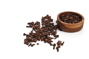 cloves on wooden bowl isolated on white background