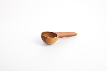 wooden sooon on white background