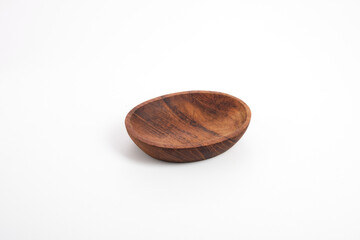 wooden saucer on white background