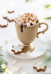 Obraz na płótnie Canvas Cup of hot chocolate with marshmallow, cookies and cinnamon on festive table. Tradition Christmas winter sweet drink.