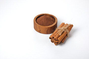 cinnamon sticks powder isolated on white background