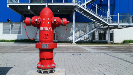 Red fire hydrant outside the building
