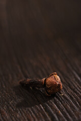 a cloves close up on wooden background