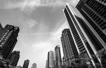 Low-angle view of the modern architectural landscape in Taichung, Taiwan. This is a monochrome image.