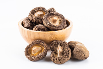 Close-up of dried shiitake mushrooms isolated on white background.