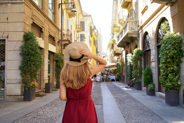 Fototapeta premium Stylish young woman walking in Brera district, Milan, Italy