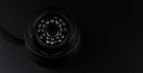 Surveillance camera, videcam, cctv camera isolated on black background close up. home security...