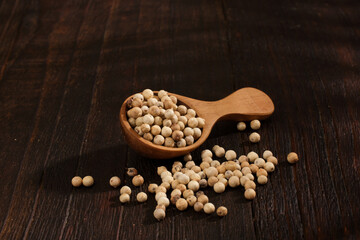 Spoon of White pepper background texture