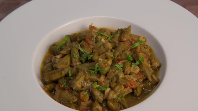 Bhindi masala or ladies finger fry served with indian roti chapati or Indian Flat bread. High quality video