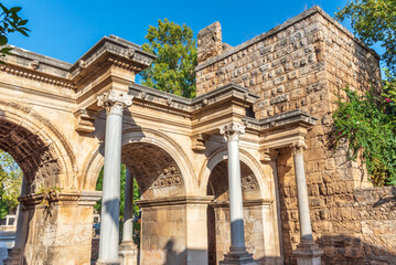 Fototapeta na wymiar Popular tourist attraction - ancient Roman Hadrian Gate in old town Antalya (Turkey) on a summer day