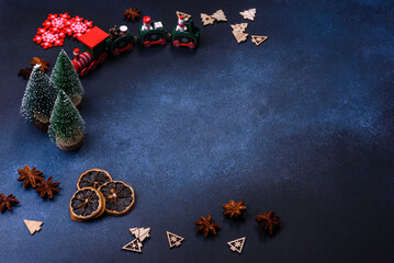 Elements of Christmas decorations, sweets and gingerbread on a wooden cutting board