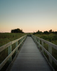 Obraz na płótnie Canvas Boardwalk trail at sunset, Fire Island, New York